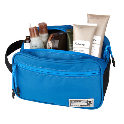 HEX Aspect Blue Dawn Dopp Kit, shown with skin care products
