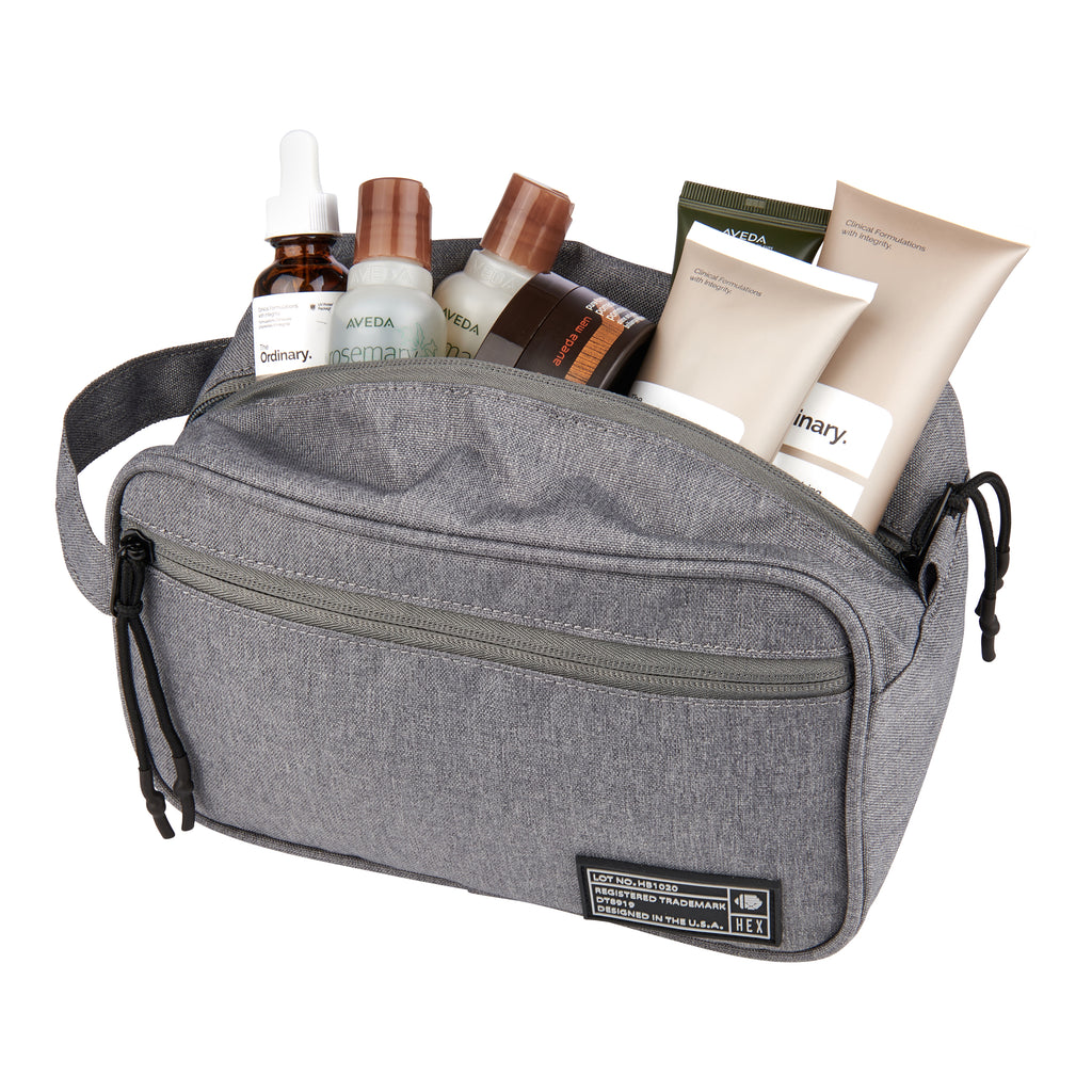 HEX Aspect Charcoal Dopp Kit, shown with skin care products