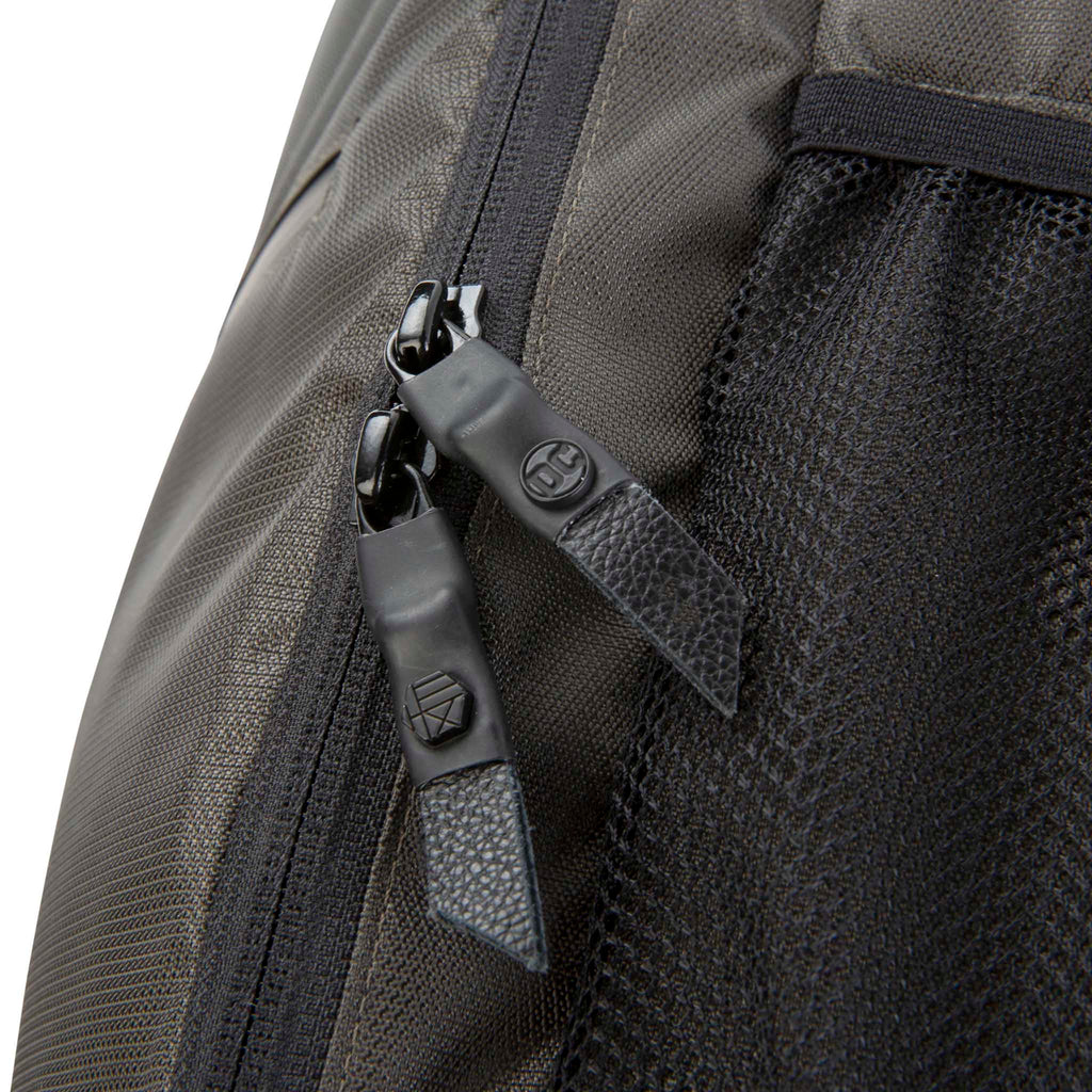 Close up of HEX x Jim Lee Artist Backpack, showing custom DC zipper pulls