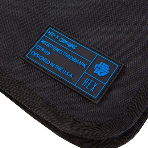 Close up of HEX x Jim Lee 11 x 17 Portfolio, showing blue/black sewn-on HEX label
