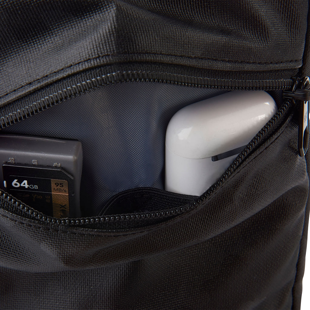 HEX Ranger Camera Crossbody Blackout Camo, showing small accessories inside zippered compartment